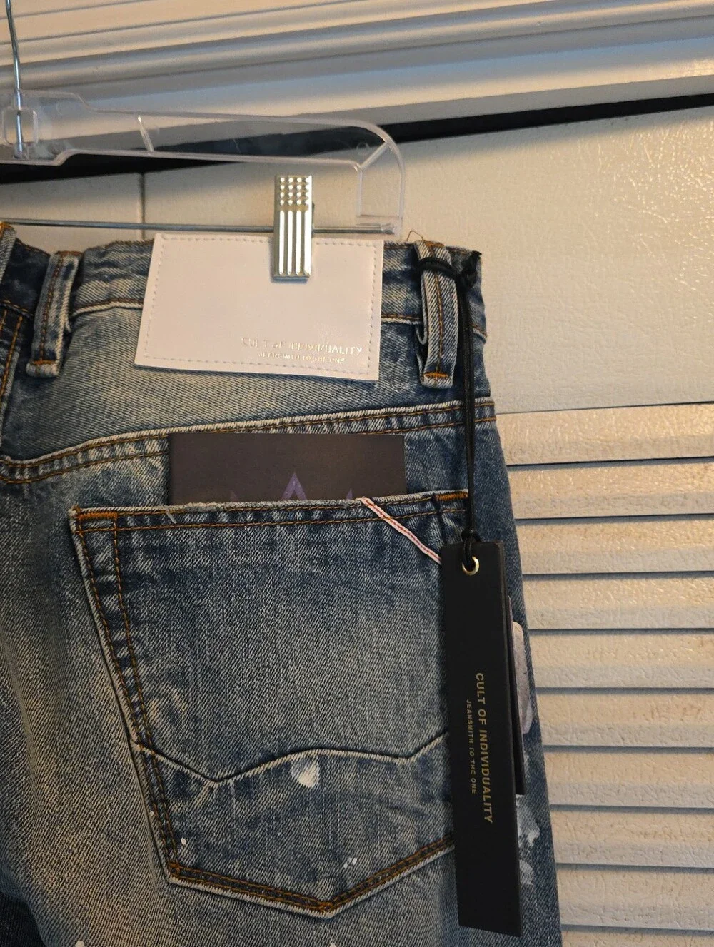 Cult of Individuality Distressed Skinny Jeans in Faded Blue with Zipper Cuffs